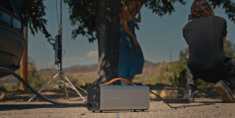 RoamEnergy powering film lights and camera gear—portable 120V from Tesla