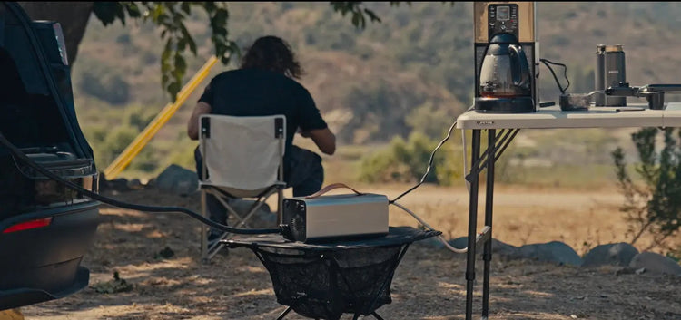 RoamEnergy powering campsite lights and devices from a Tesla—quiet 120V AC